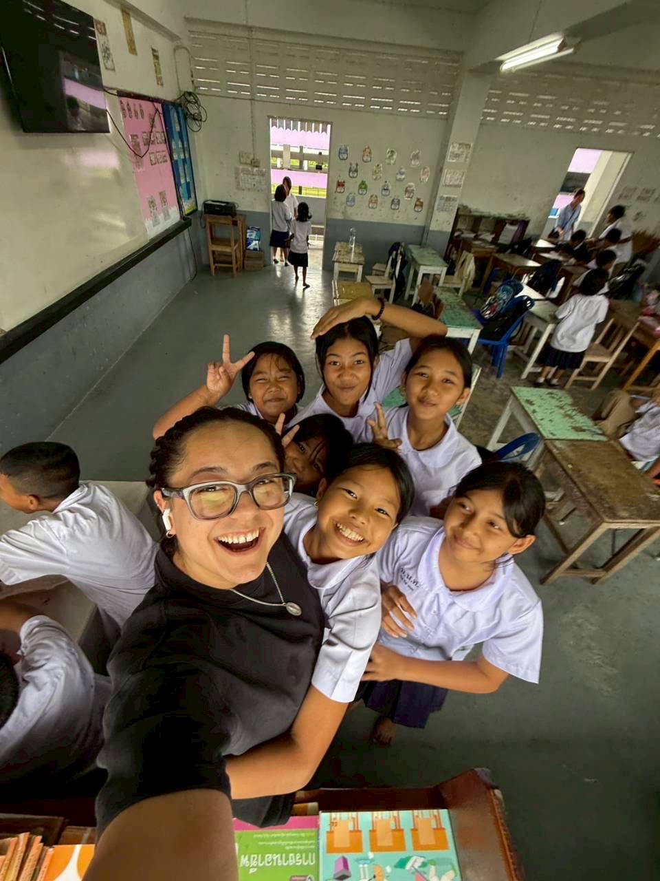 Intern selfie with students pulling funny faces