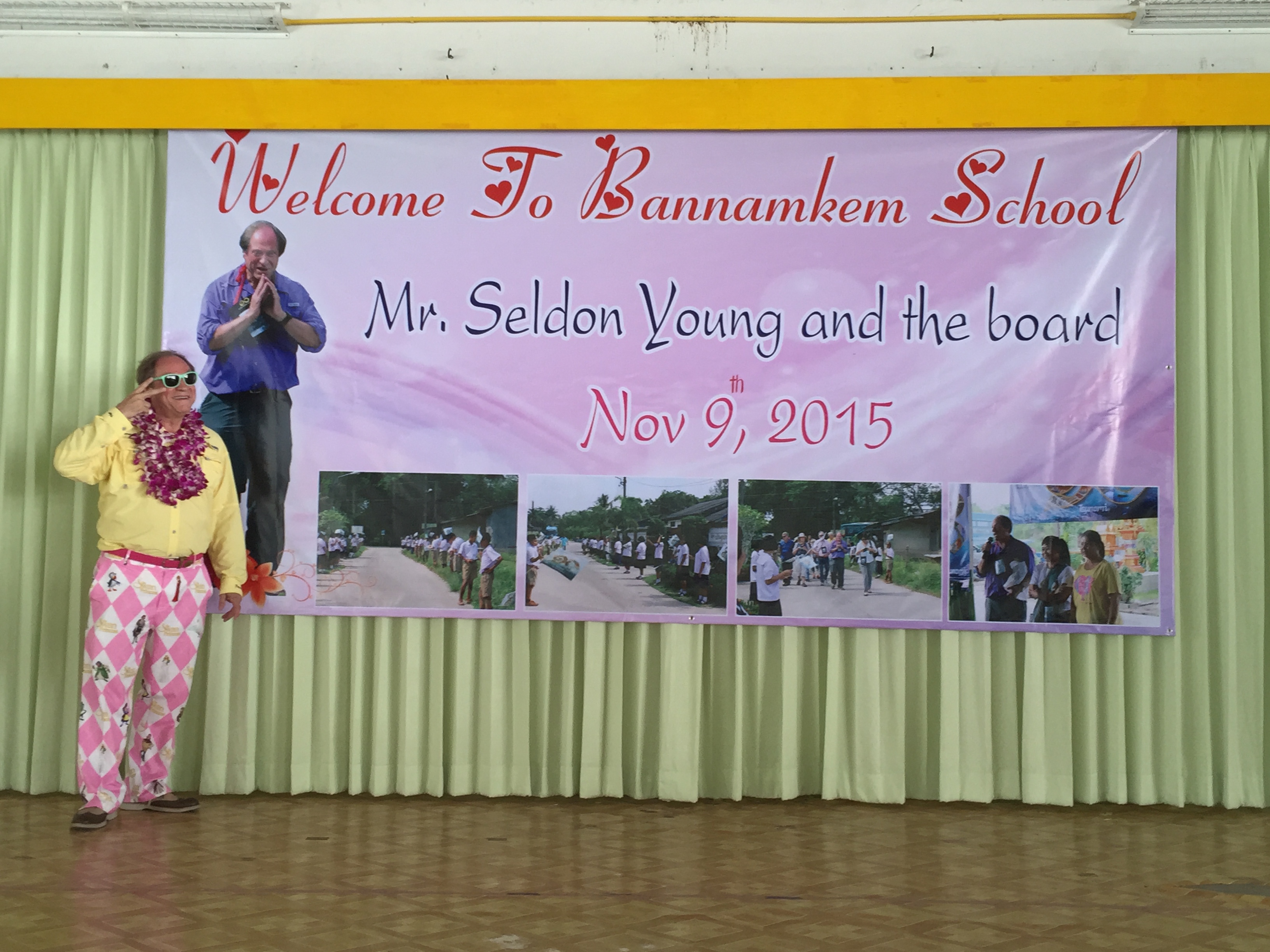 Mr. Seldon in pink argyle pants on stage